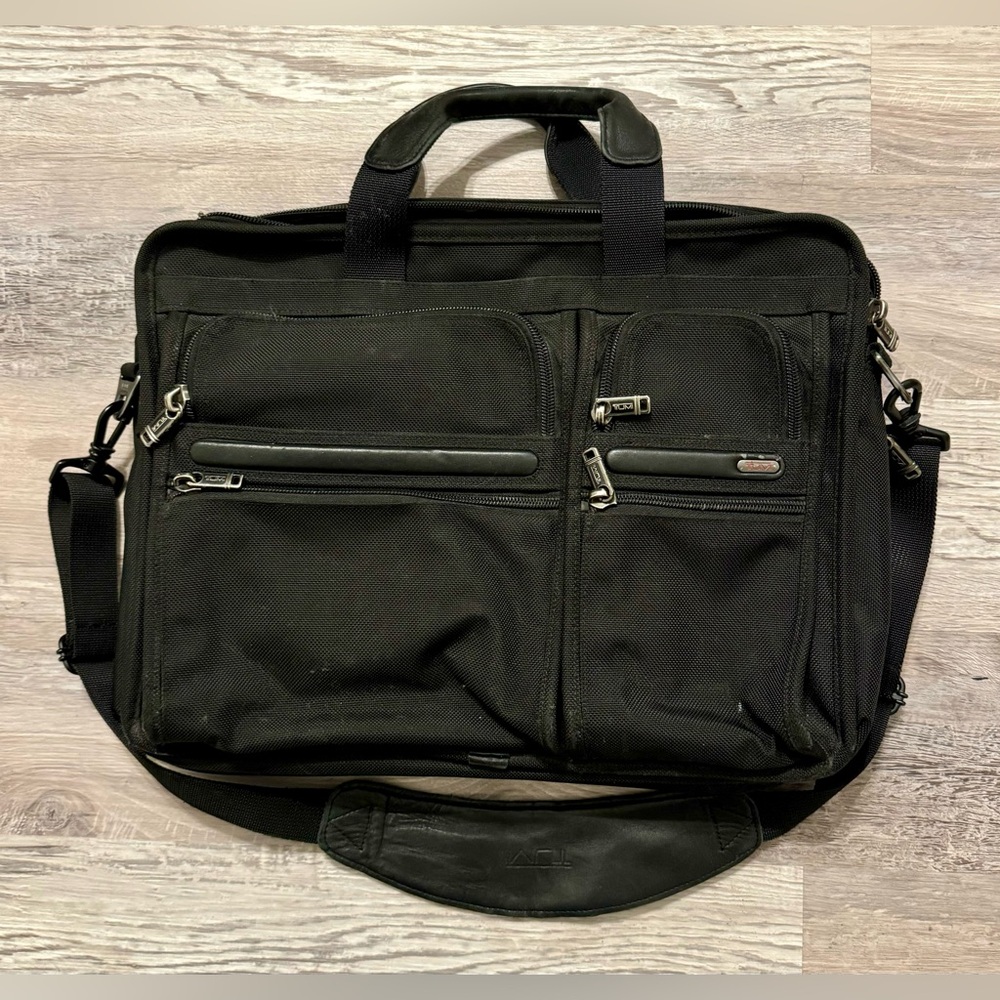 TUMI black laptop carrier bag. It has wallet inside.  It has various - Picture 2 of 15